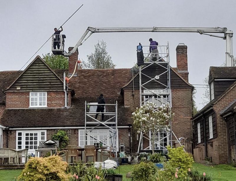 The Roof Moss Cleaners using cherry picker and scaffolding to clean roof safely and professionally in Amersham, Buckinghamshire
