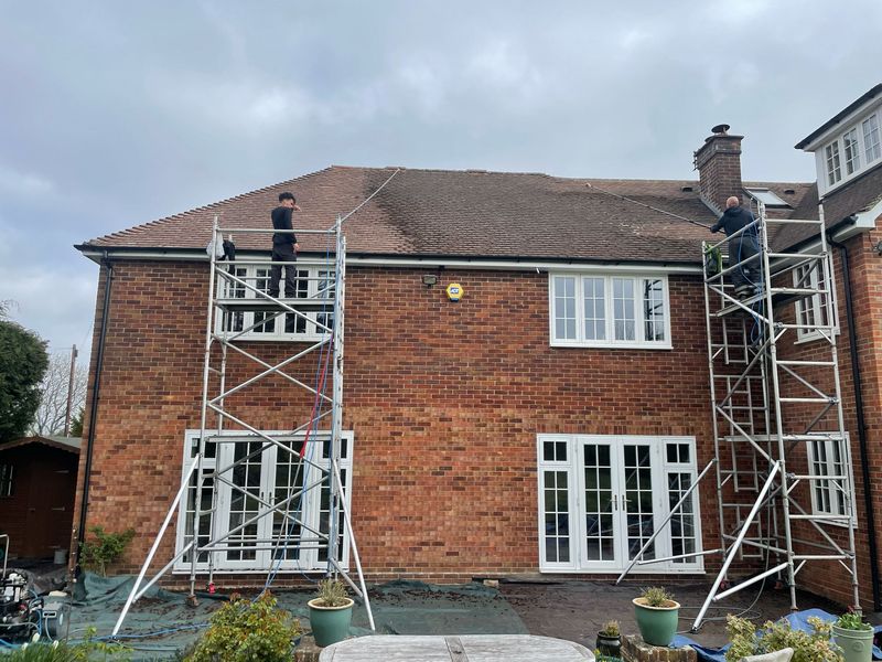 Roof cleaning carried out safely from scaffold towers by The Roof Moss Cleaners in Amersham